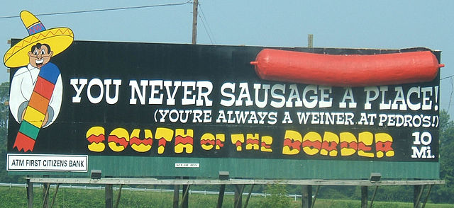 640px-South_of_the_Border_sign_10_-_You_never_sausage_a_place
